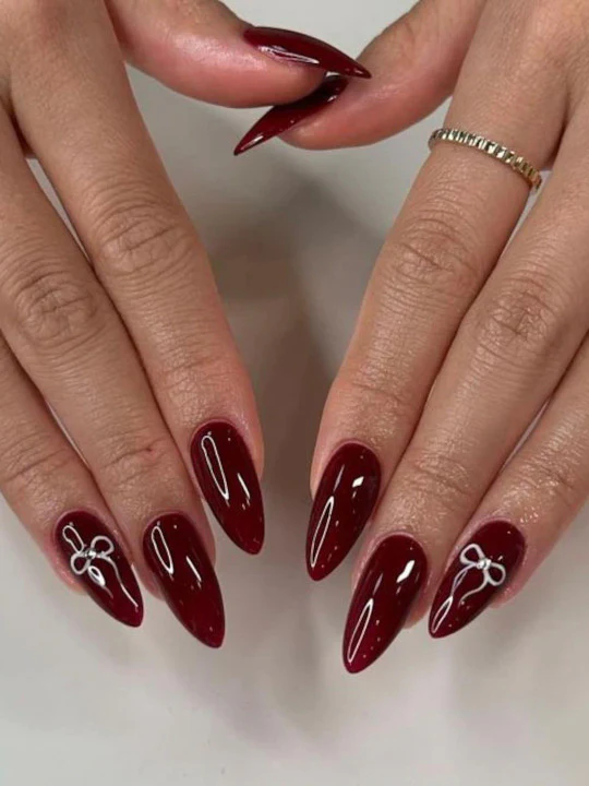 Burgundy Nails With Bow Accents